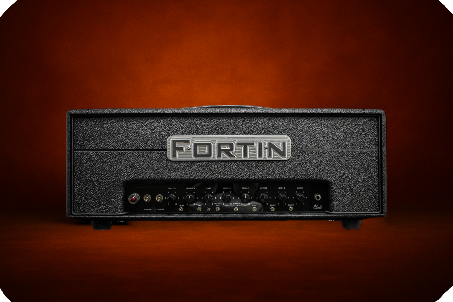 Fortin Cali Blackout guitar amp head on a transparent background with a soft burnt-orange glow behind it