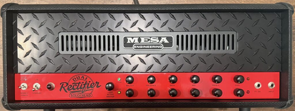 Mesa Boogie Dual Rectifier Solo Head guitar amplifier front panel with black diamond-plate finish and red control panel